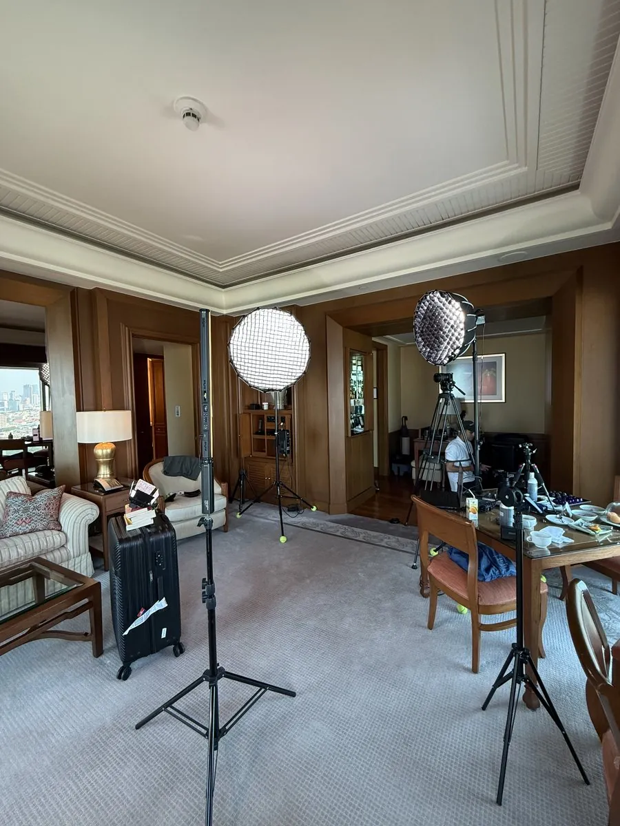Hotel room set up with lights for filming